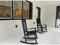 Charming front porch with rocking chairs, perfect for relaxing outdoors at 871 Cowan Se Rd, Conyers, GA 30094