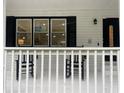 Exterior view of front porch with rocking chairs at 871 Cowan Se Rd, Conyers, GA 30094