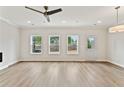 Bright living room featuring large windows, wood flooring, and a neutral color palette at 113 Priestwood Ln, Acworth, GA 30102