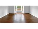 Sun-filled room with hardwood floors and bright bay windows at 2397 Charleston Ter, Decatur, GA 30034
