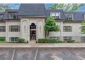 Well-maintained condo exterior featuring a classic facade, landscaped grounds, and convenient parking access at 30 Chaumont Nw Sq, Atlanta, GA 30327