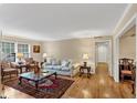 Bright living room featuring hardwood floors, neutral walls, and a cozy seating arrangement at 30 Chaumont Nw Sq, Atlanta, GA 30327
