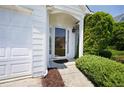 A close up of the front door and manicured shrubbery at 4527 Baker Grove Nw Rd, Acworth, GA 30101