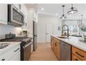 Modern kitchen featuring stainless steel appliances, a gas cooktop, and a white subway tile backsplash at 436 Carrera Ln, Acworth, GA 30102