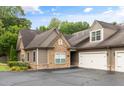 Charming home with stone and neutral siding, complemented by a two-car garage and well-maintained landscaping at 325 Ridge Hill Cir # 3, Marietta, GA 30064