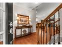 Inviting foyer with hardwood floors, a staircase, and a console table displaying artwork and lamps at 325 Ridge Hill Cir # 3, Marietta, GA 30064