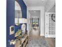 Beautiful entryway featuring a console table, attractive lighting, and wood flooring at 515 Regency Trl, Acworth, GA 30102