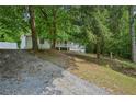 Exterior view of house with gravel base and some trees in the background at 6201 Davids Se Way, Acworth, GA 30102