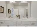 Bathroom with double vanity, modern fixtures, and large mirror at 2030 Main Nw St # 205, Atlanta, GA 30318