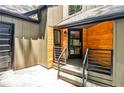 Close up of home entrance featuring a modern glass door and wood accents at 2189 Cedar Forks Dr, Marietta, GA 30062