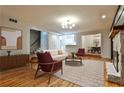 Inviting living room with hardwood floors, fireplace and modern furnishings at 2189 Cedar Forks Dr, Marietta, GA 30062