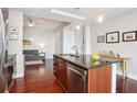 Kitchen with dark cabinets, stainless steel appliances, and an island for seating at 4561 Olde Perimeter Way # 806, Dunwoody, GA 30346