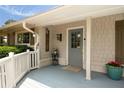Inviting front porch with stylish door, plants, and a 'Welcome' sign enhancing curb appeal at 1100 Tuxedo Dr, Roswell, GA 30075