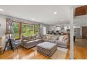 Bright living room with hardwood floors, a comfortable seating arrangement, and a view to the kitchen at 2720 Birchwood Sw Way, Marietta, GA 30060