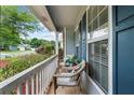 Inviting front porch with seating area, perfect for relaxing outdoors at 4178 Mcever Park Dr, Acworth, GA 30101