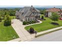 Gorgeous suburban house featuring an inviting entrance, landscaped garden, and a basketball court beside the driveway at 5070 Laurel Ridge Dr, Cumming, GA 30040