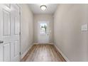 Bright entryway with wood-look flooring and a view of the outdoors at 486 Charleston Pl, Villa Rica, GA 30180
