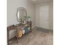 Elegant entryway showcasing wood-look floors, a console table, and a decorative mirror at 507 Regency Trl, Acworth, GA 30102