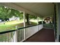 Relaxing covered front porch with views of the landscaped yard and neighboring homes at 188 Thornbrooke Dr, Hiram, GA 30141