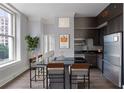 Modern kitchen with stainless steel appliances, granite countertops, and breakfast bar seating at 57 Forsyth Nw St # 6A, Atlanta, GA 30303