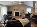 Spacious living room boasts a fireplace, vaulted ceiling, and an open floor plan at 2529 Feathertree Ln, Lawrenceville, GA 30044