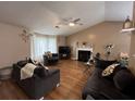 Comfortable living room with vaulted ceilings, fireplace, and neutral color palette at 2529 Feathertree Ln, Lawrenceville, GA 30044