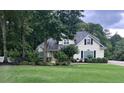 Charming home with well-maintained lawn and mature landscaping at 9707 Squirrel Wood Run, Douglasville, GA 30135