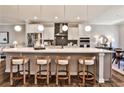 The modern kitchen features an island with seating and a view of the dining area at 1047 Brandsford Nw St, Atlanta, GA 30318