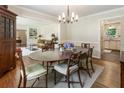 Cozy dining room with wood table, chandelier, and hardwood floors, ideal for gatherings at 3042 Argonne Dr, Atlanta, GA 30305
