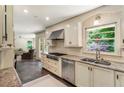 Well-equipped kitchen with stainless steel appliances, granite countertops, and ample cabinet space at 3042 Argonne Dr, Atlanta, GA 30305