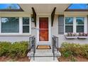Inviting front entrance with charming details, decorative flower boxes, and a 