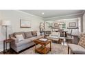 Cozy living area with a comfortable sofa, stylish decor, and an open layout to the dining room at 834 Timberland Se St, Smyrna, GA 30080