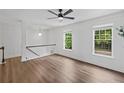 Bright loft space with hardwood floors, natural light, and ample room for various activities at 3729 Inglewood Ne Way, Atlanta, GA 30319