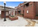 Charming brick townhome with well-maintained landscaping and a welcoming courtyard entrance at 387 Ralph Mcgill Ne Blvd # K, Atlanta, GA 30312