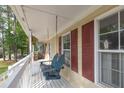 Close up of a porch swing with cushions and pillows at 422 Inwood Trail Trl, Lawrenceville, GA 30043