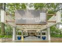 View of Renaissance Lofts entrance with porte cochere, landscaping, and convenient access at 120 Ralph Mcgill Ne Blvd # 1502, Atlanta, GA 30308