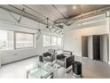 Bright living room with city views, featuring modern furnishings and industrial-chic accents at 120 Ralph Mcgill Ne Blvd # 1502, Atlanta, GA 30308