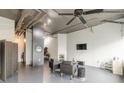 Open living area featuring exposed ductwork, modern furnishings and lots of light at 120 Ralph Mcgill Ne Blvd # 1502, Atlanta, GA 30308