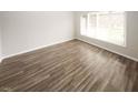 Inviting space featuring wood-look floors and a bright window for natural light at 1200 Ashborough Se Ter # A, Marietta, GA 30067