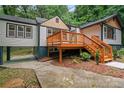 Beautiful home exterior with covered parking and wooden deck, ideal for relaxing outdoors at 243 Howell Ter, Atlanta, GA 30331