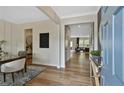 Inviting foyer features beautiful hardwood floors, neutral decor and a view into the home's open-concept living spaces at 288 Rockledge Sw Bnd, Powder Springs, GA 30127