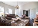 Bright living room featuring hardwood floors, a cozy seating area, and natural light from the windows at 360 Kelly Se St, Atlanta, GA 30312