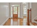 Bright foyer boasts hardwood floors and detailed trim at 5513 Lavender Farms Rd, Powder Springs, GA 30127