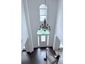 Grand two-story foyer with chandelier and hardwood floors at 1991 Westover Nw Ln, Kennesaw, GA 30152