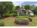 Community clubhouse surrounded by lush greenery, offering a serene and inviting gathering space at 382 Winston Circle Cir, Canton, GA 30114