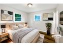 Comfortable bedroom with neutral decor, plush bedding, and ample natural light at 145 Washington St, Mcdonough, GA 30253