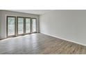 Bright living room with stylish wood floors and access to a private balcony at 3650 Ashford Dunwoody Rd, Ne, #923 # 923, Atlanta, GA 30319