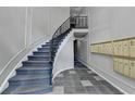 Elegant curved staircase with wrought iron railing and stylish tiled floor at 3650 Ashford Dunwoody Rd, Ne, #923 # 923, Atlanta, GA 30319