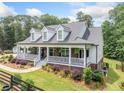 Inviting home exterior featuring a well-maintained yard and classic architectural details at 1280 Trinity Church Rd, Canton, GA 30115