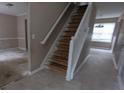 Staircase with white railing leading to the upper level of the home at 3679 Seabass Rd, Decatur, GA 30034